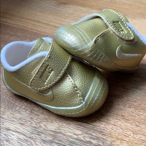 Nike gold baby shoes with rubber soft soles